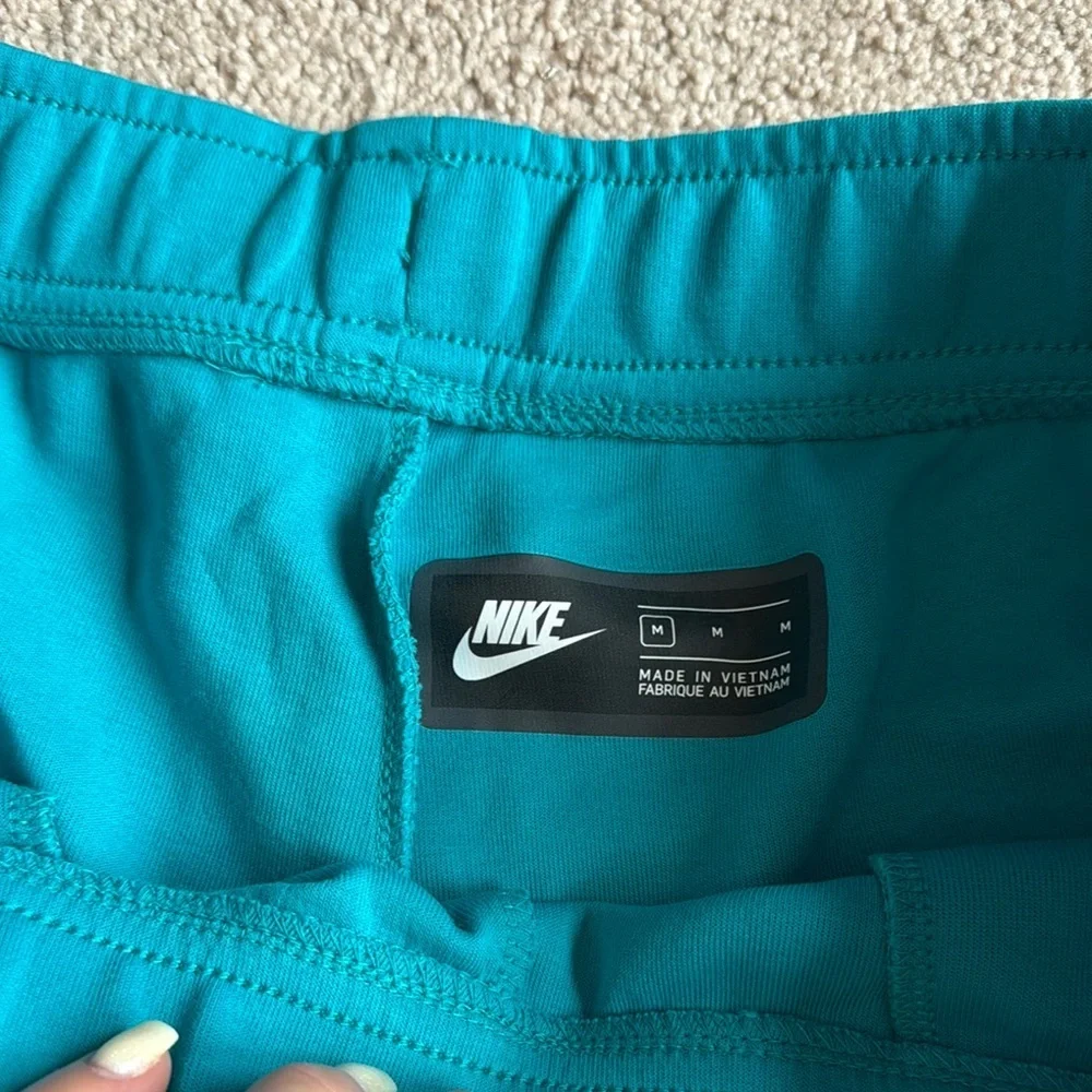 Nike Men's Teal Shorts with Red Logo